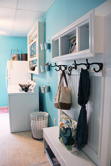 aqua blue laundry room with mud bench