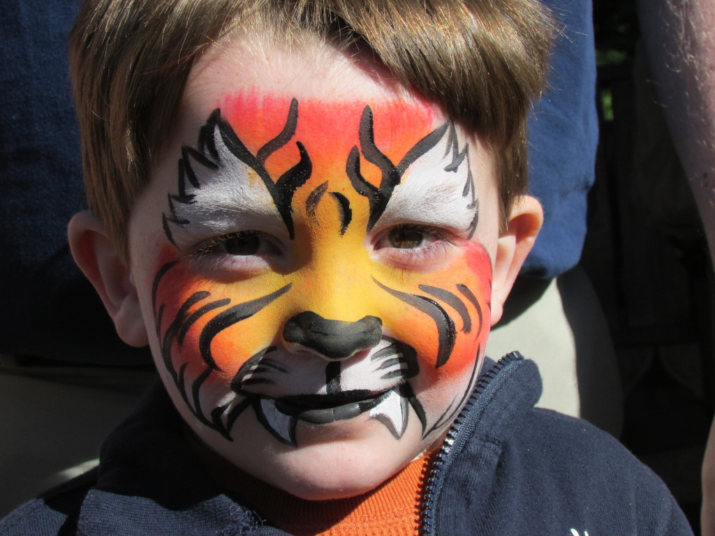 face paint at Disney is perfect for young kids! If they can sit and be patient while having their face painted, reward them with a treat for their good behavior.