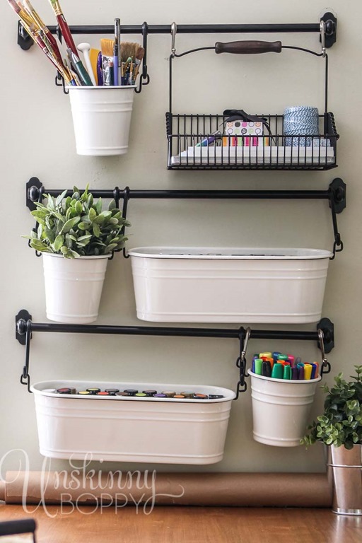 white buckets holding craft supplies