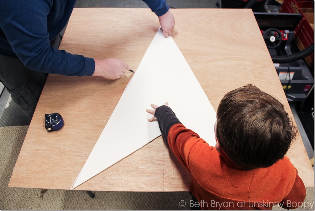 Get yourself a helper! Carefully trace the star point template on the sheet wood. 