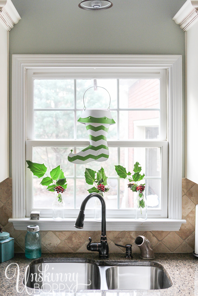 Spray paint an outdated metal Christmas stocking with a fun chevron pattern using Frogtape Shapetape for a fresh, fun Christmas kitchen window.