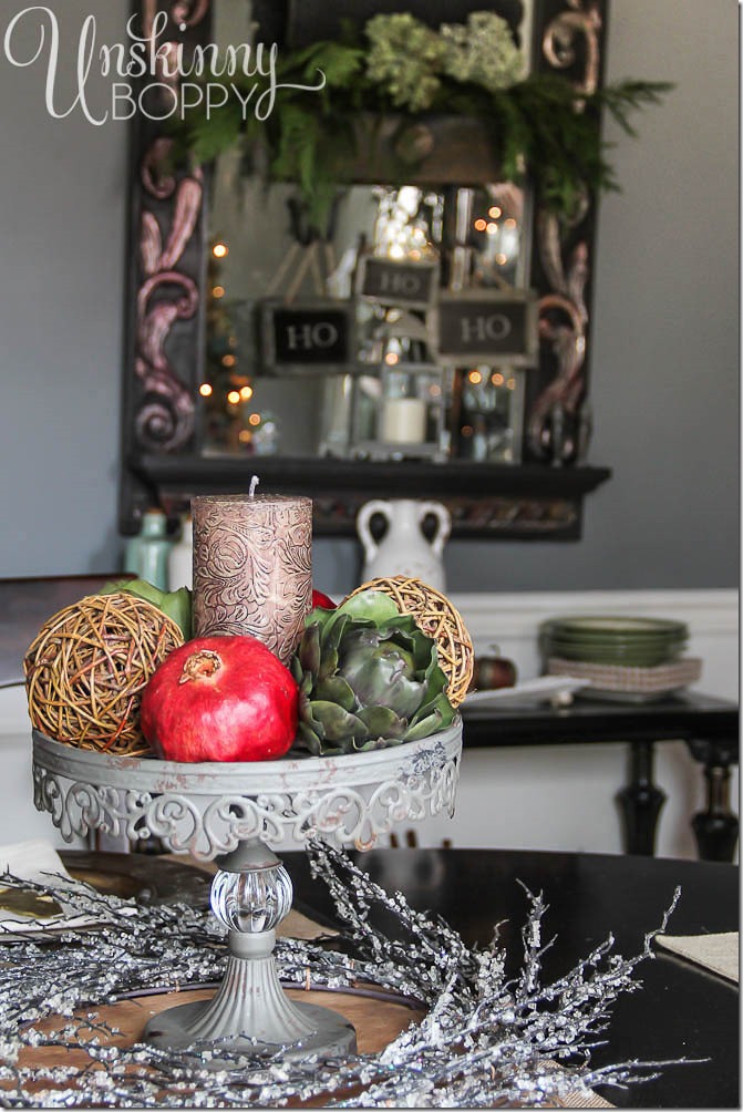 Holiday tablescape with pomegranates and artichokes