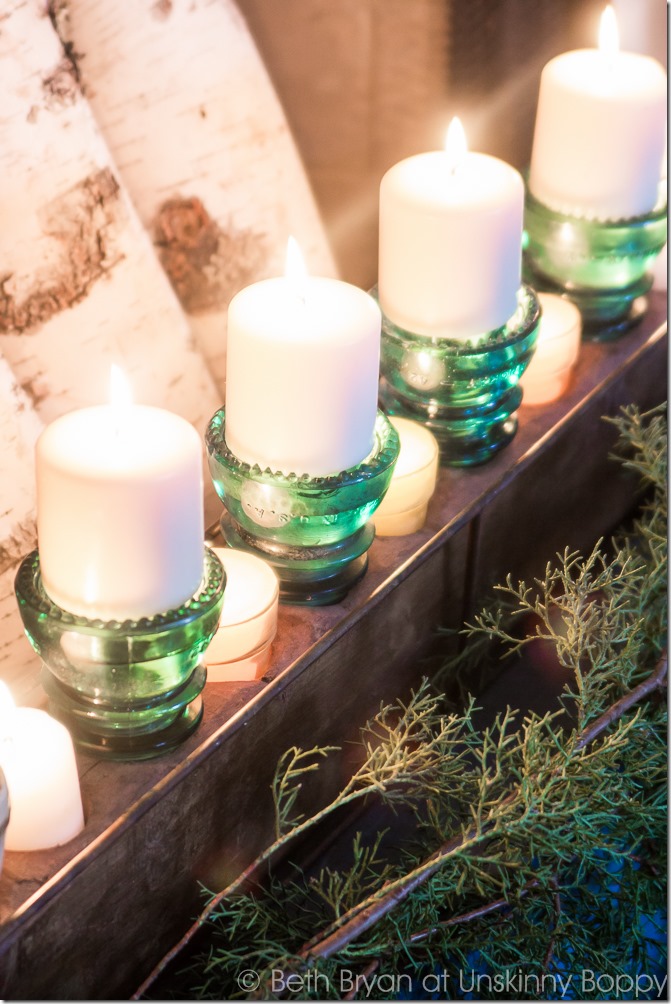 Glass insulators turned upside down for candle holders