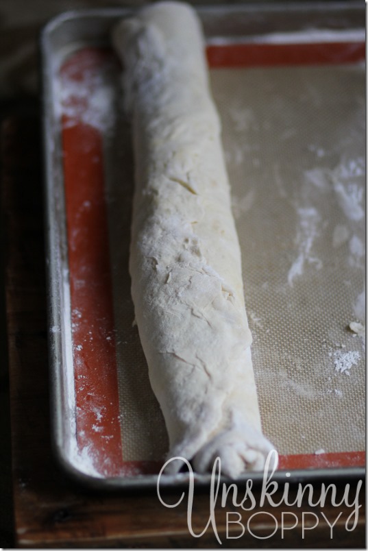 Roll the sheet of dough, making sure to roll horizontally across the sheet.