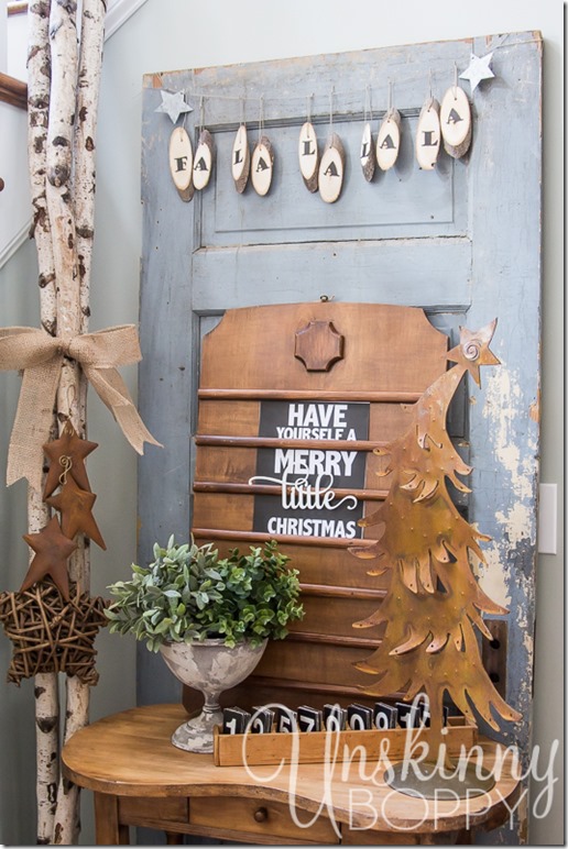 So many great things happening in this photo!  Love the wood slice bunting and the vintage church sign with 