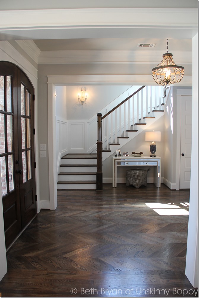 Foyer with herringbone pattern in hardwoods. 2015 Birmingham Parade of Homes built by Murphy Home Builders 