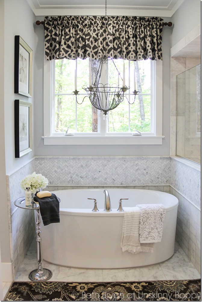 Tub bath with grey herringbone backsplash. 2015 Birmingham Parade of Homes 