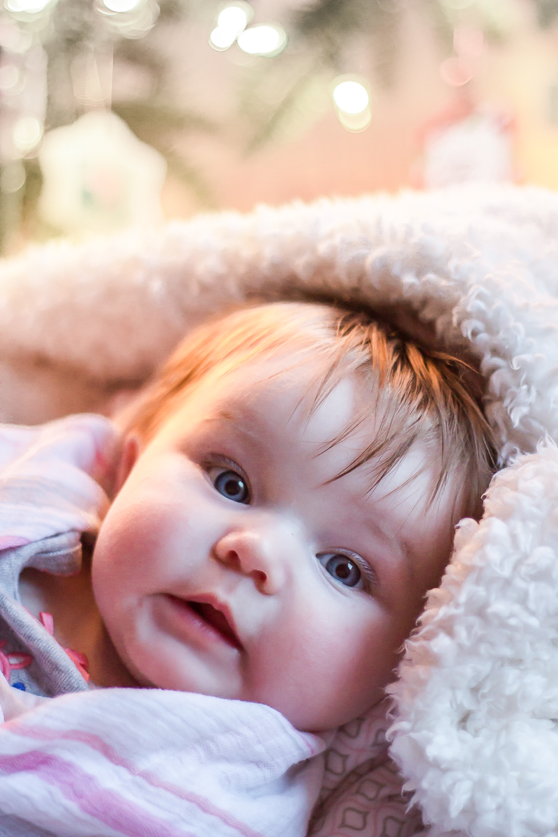 C in front of tree 3 months