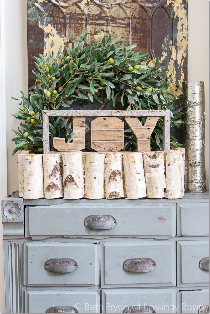 Holiday decorations on an old apothecary cabinet-- Great Christmas Decorating Ideas inside this post! 