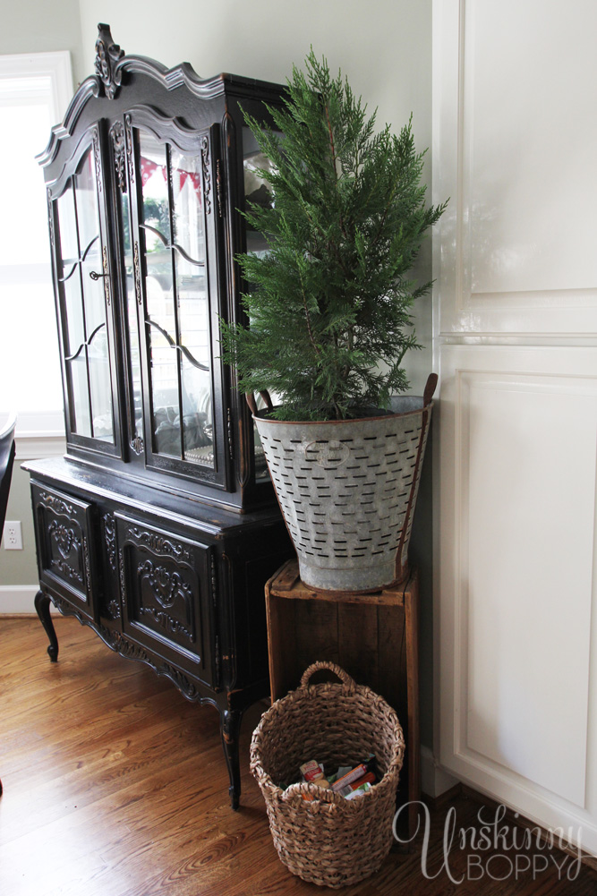 Use an olive bucket on a crate as a plant stand