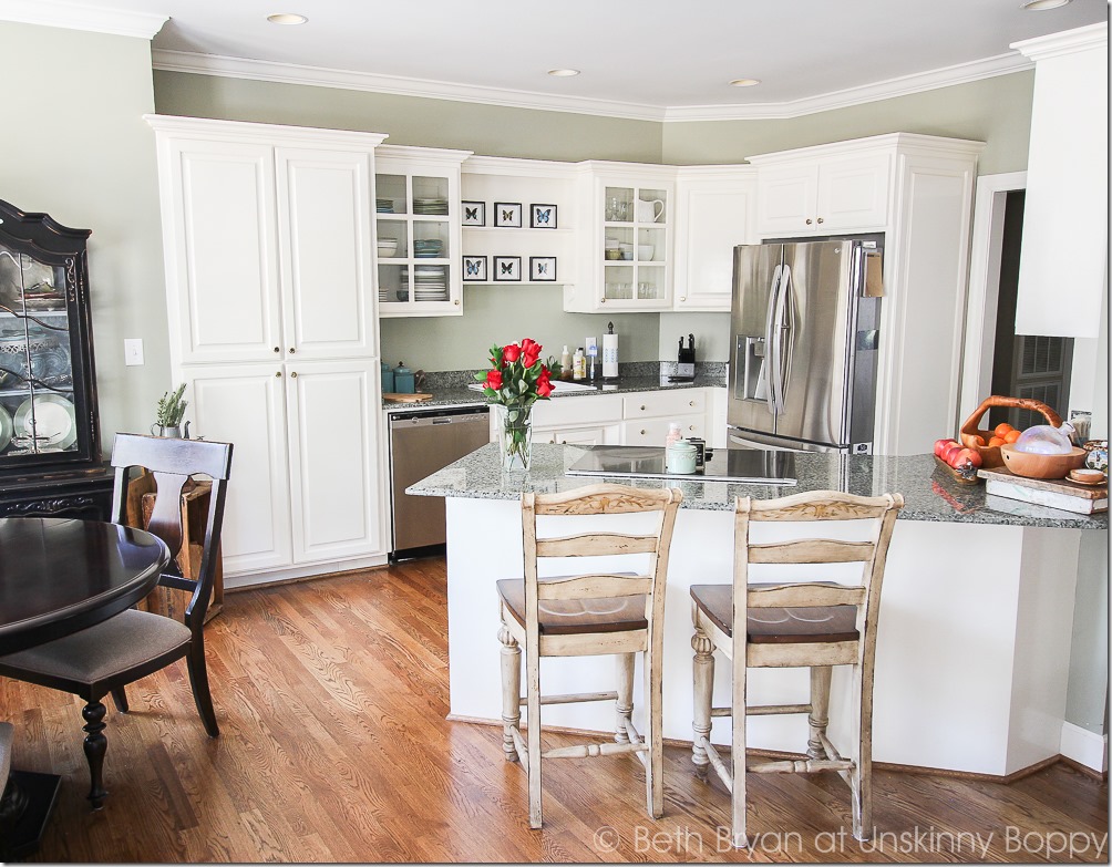 White kitchen with green granite counters