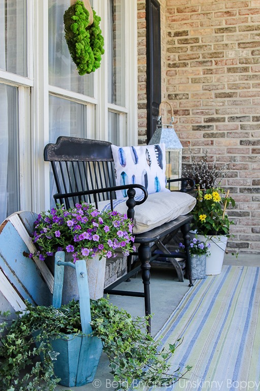 Black colonial bench from Park Hill Collection on front porch