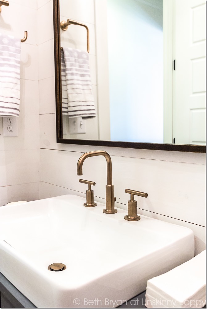 aged bronze bathroom fixtures with shiplap - modern bath