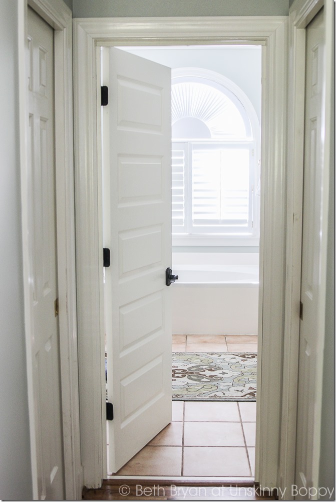 We added a door to the cased opening in our master bedroom. It's a simple DIY project that's the perfect privacy solution!