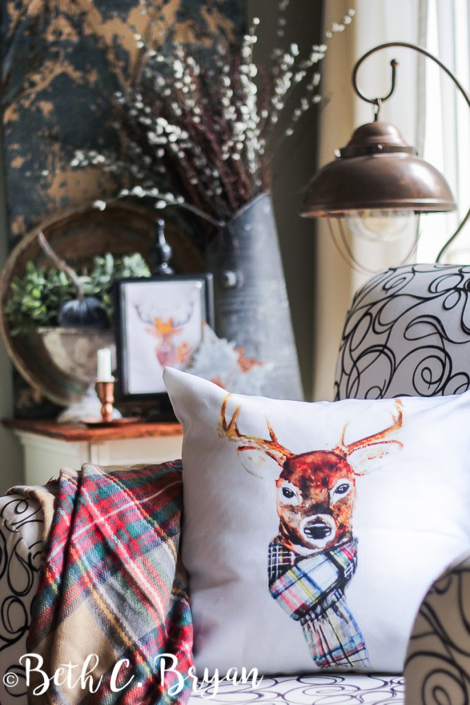 Fall Deer Pillow wearing plaid scarf