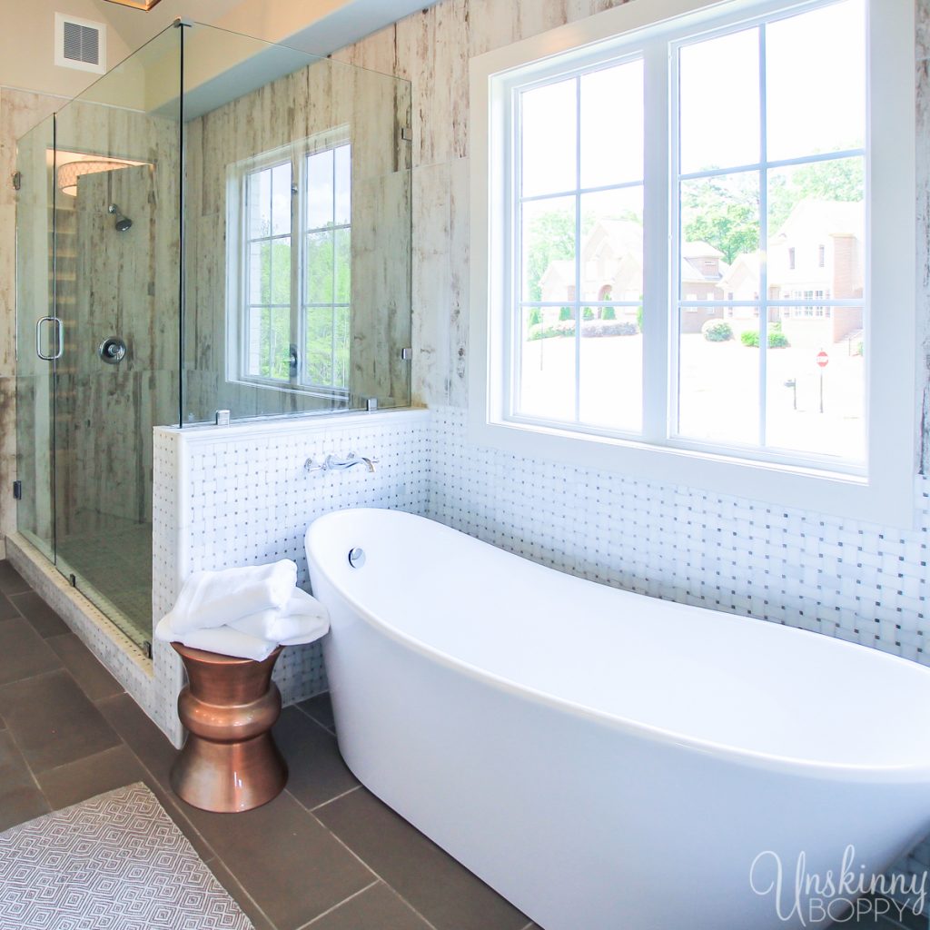 Huge soaking tub and glass shower in master bath