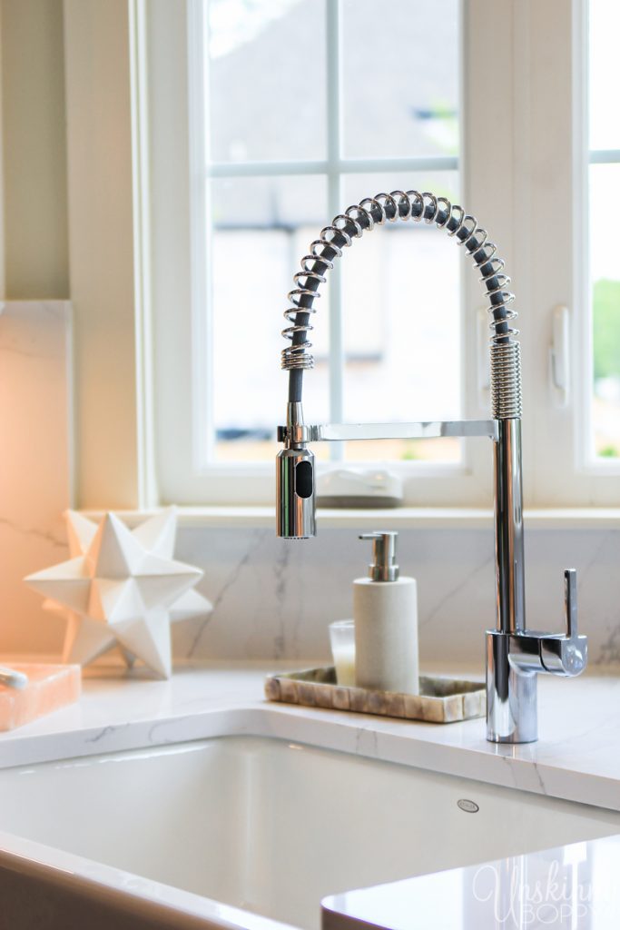 Corner sink in kitchen with windows