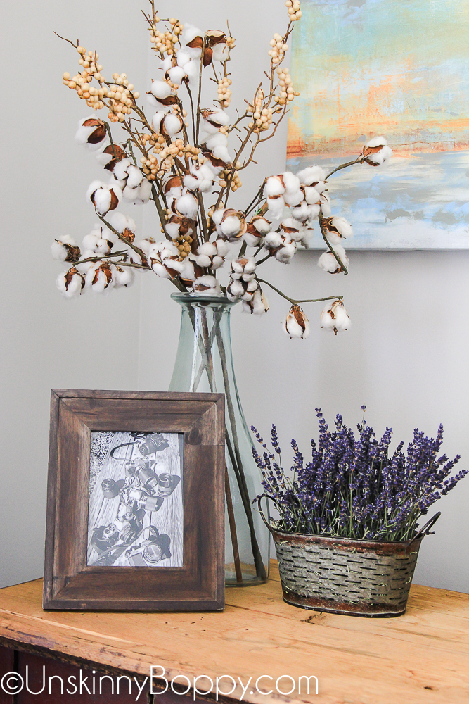 cotton stems and lavender in an olive bucket