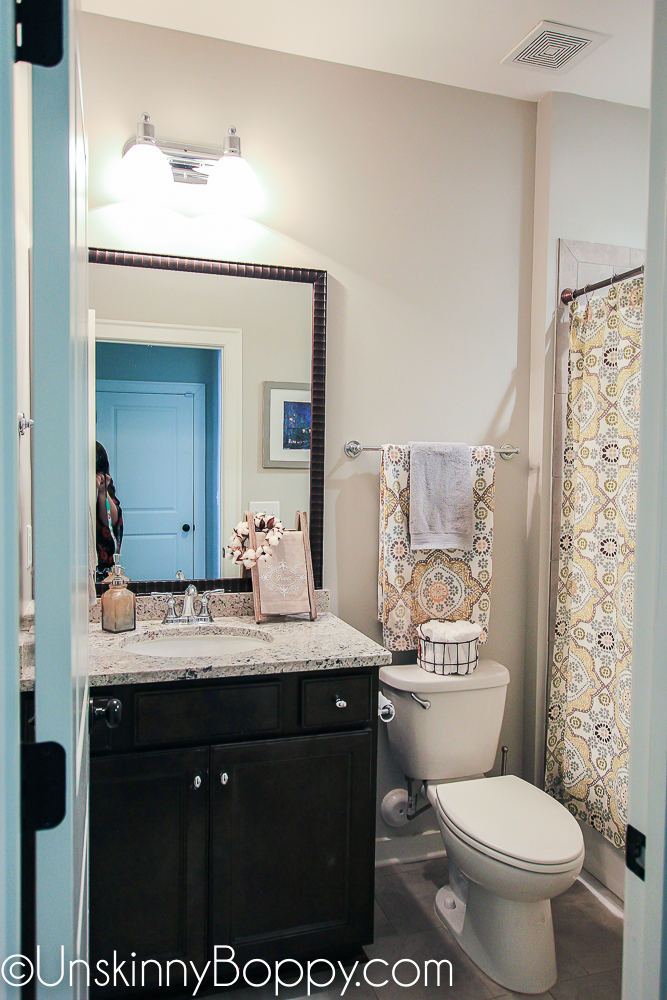 Bathroom decor with black vanity