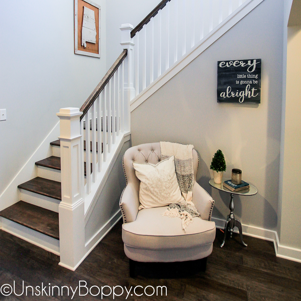 Staircase with cozy reading chair in the corner