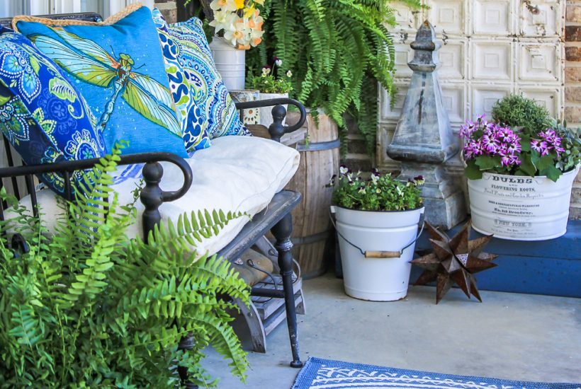 Narrow front porch decorated for summer