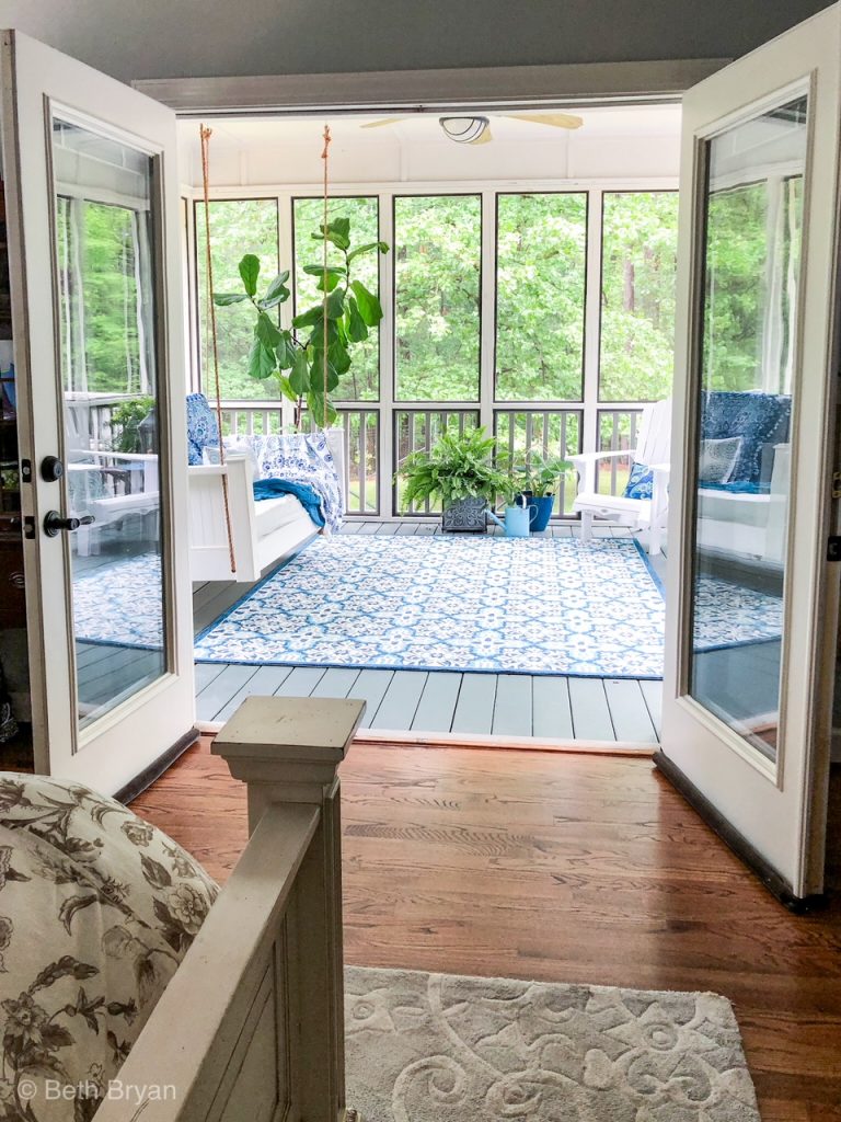 Screened in back porch off master bedroom creates an outdoor room. 