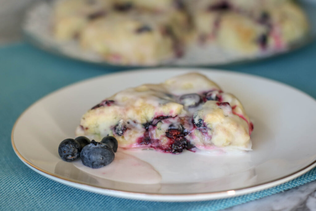 blueberry lemon scone on white plate 