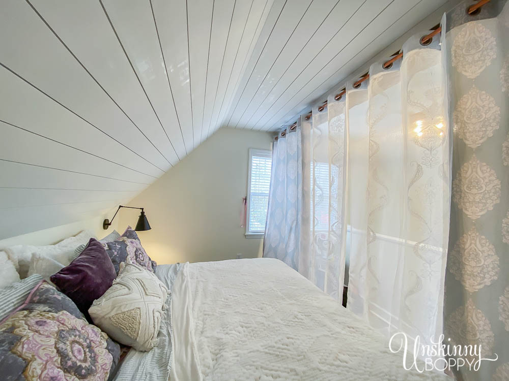 Dreamy loft bedroom makeover with Bohemian vibe, hand hewn beam and sheer curtains