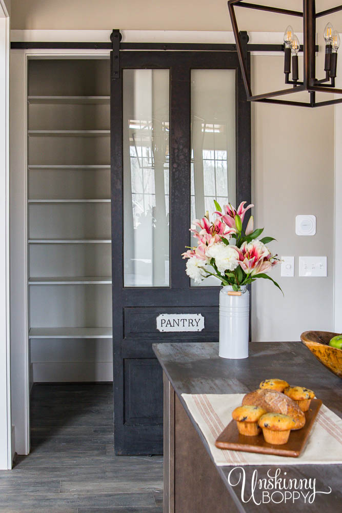 Custom barn door with glass inserts for pantry 