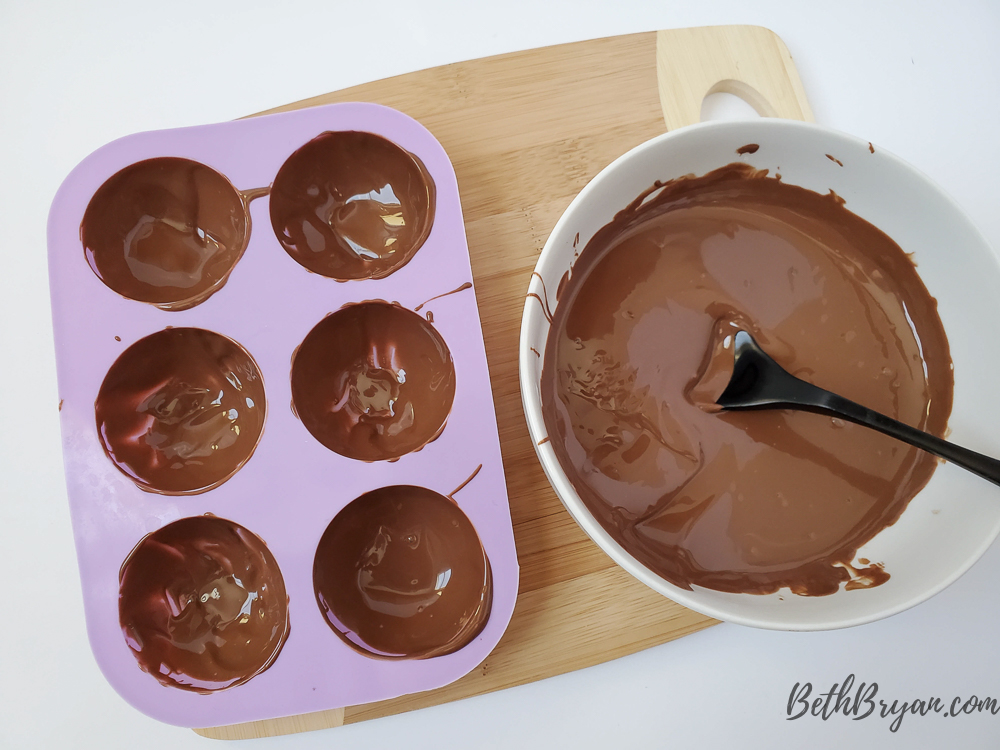 add chocolate to molds