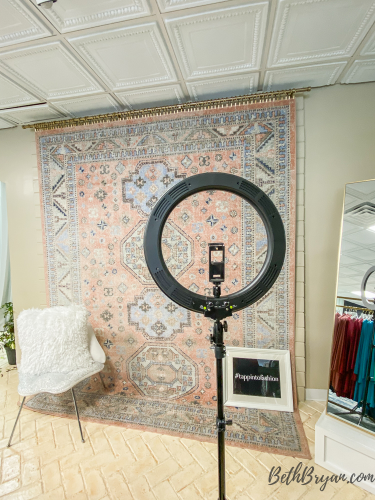 selfie station with rug on wall at tapp18