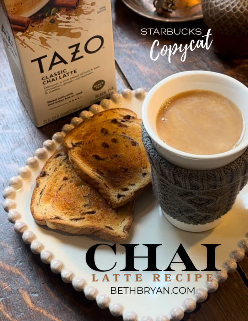 how to make starbucks copycat chai latte at home - wooden table with hot cup of chai on a plate with toast